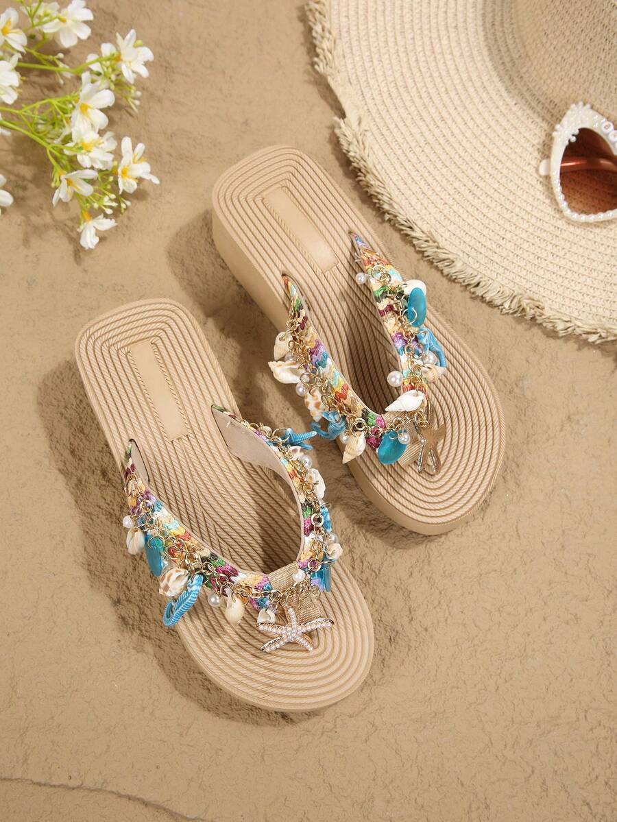 Beige platform wedge flip flop slippers featuring decorative chain and shell details with EVA sole for women.