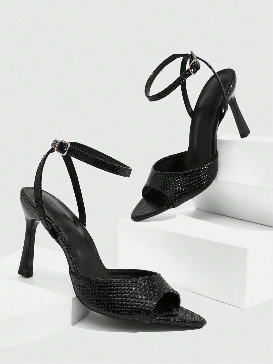 Minimalist women's open toe high heel sandals featuring a slender stiletto heel and adjustable ankle strap buckle closure.