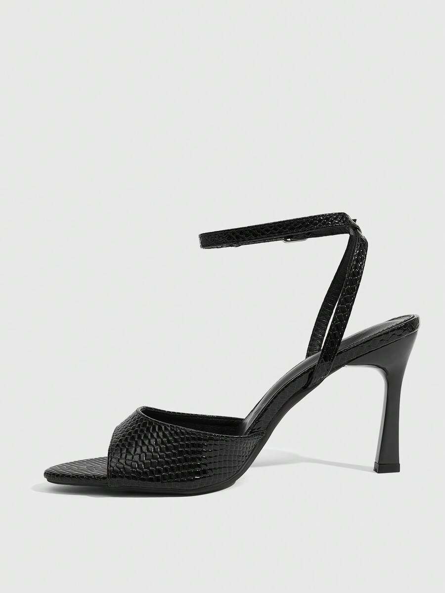 Minimalist women's open toe high heel sandals featuring a slender stiletto heel and adjustable ankle strap buckle closure.