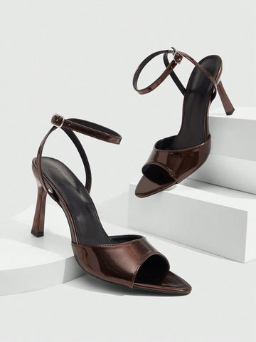 Minimalist women's open toe high heel sandals featuring a slender stiletto heel and adjustable ankle strap buckle closure.