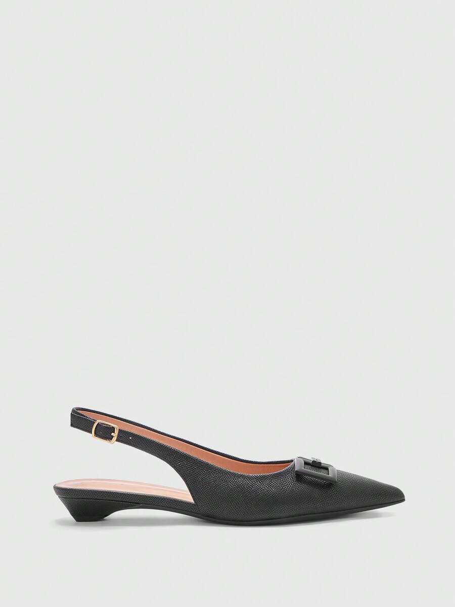 Women's pointed toe low wedge flat shoes crafted in PU leather with a slingback strap and stylish metal buckle detail.