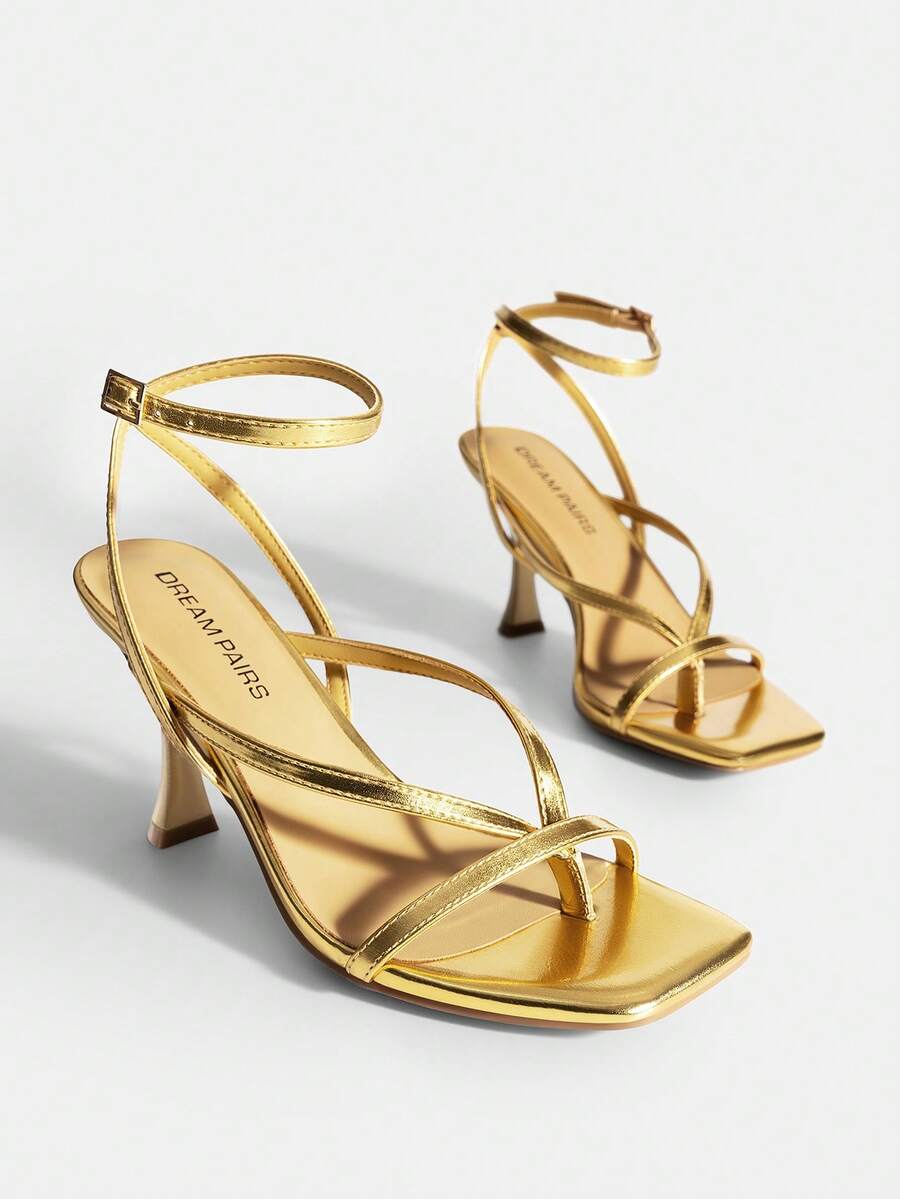 Open square toe kitten heel thong sandals with delicate cross-over straps and an adjustable ankle buckle strap.