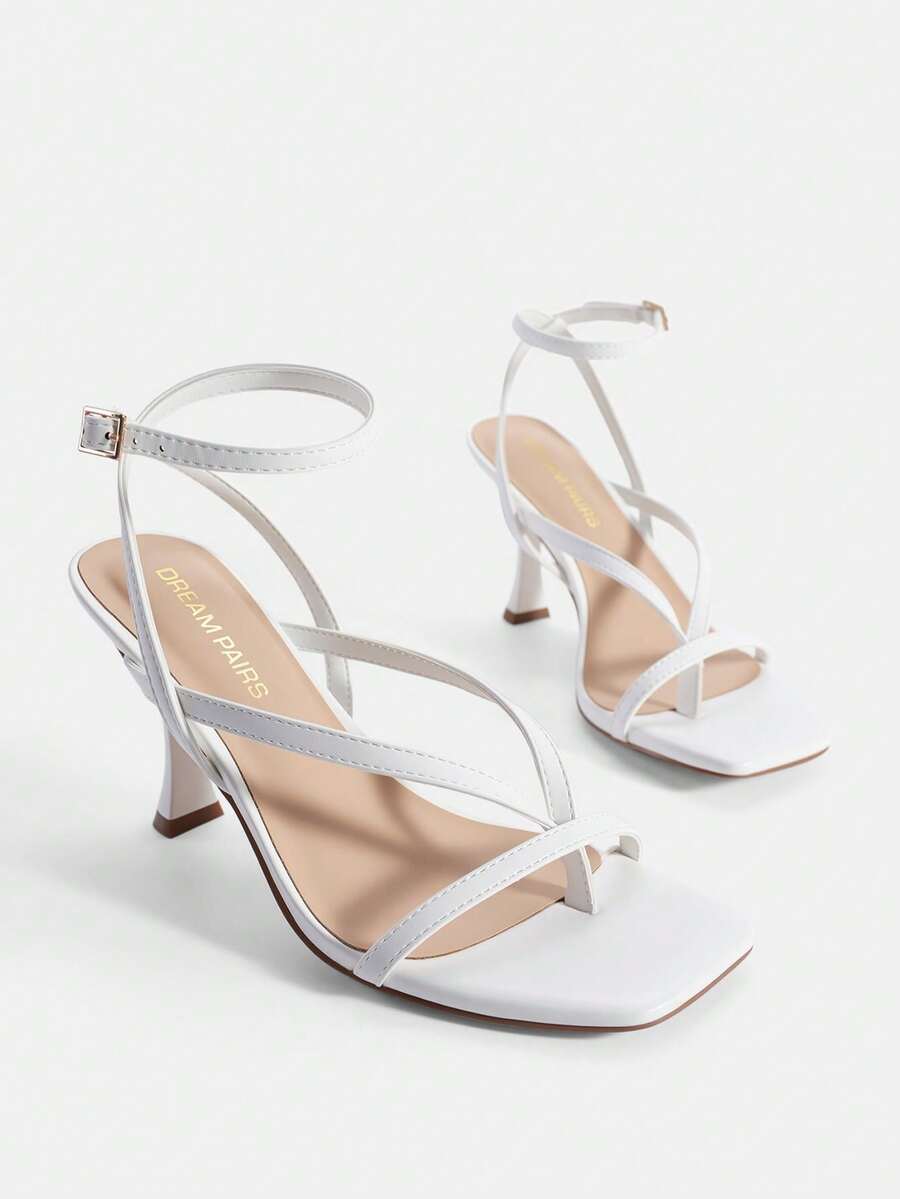 Open square toe kitten heel thong sandals with delicate cross-over straps and an adjustable ankle buckle strap.