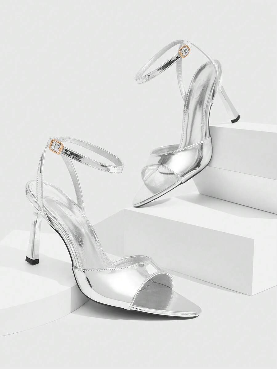 Minimalist women's open toe high heel sandals featuring a slender stiletto heel and adjustable ankle strap buckle closure.