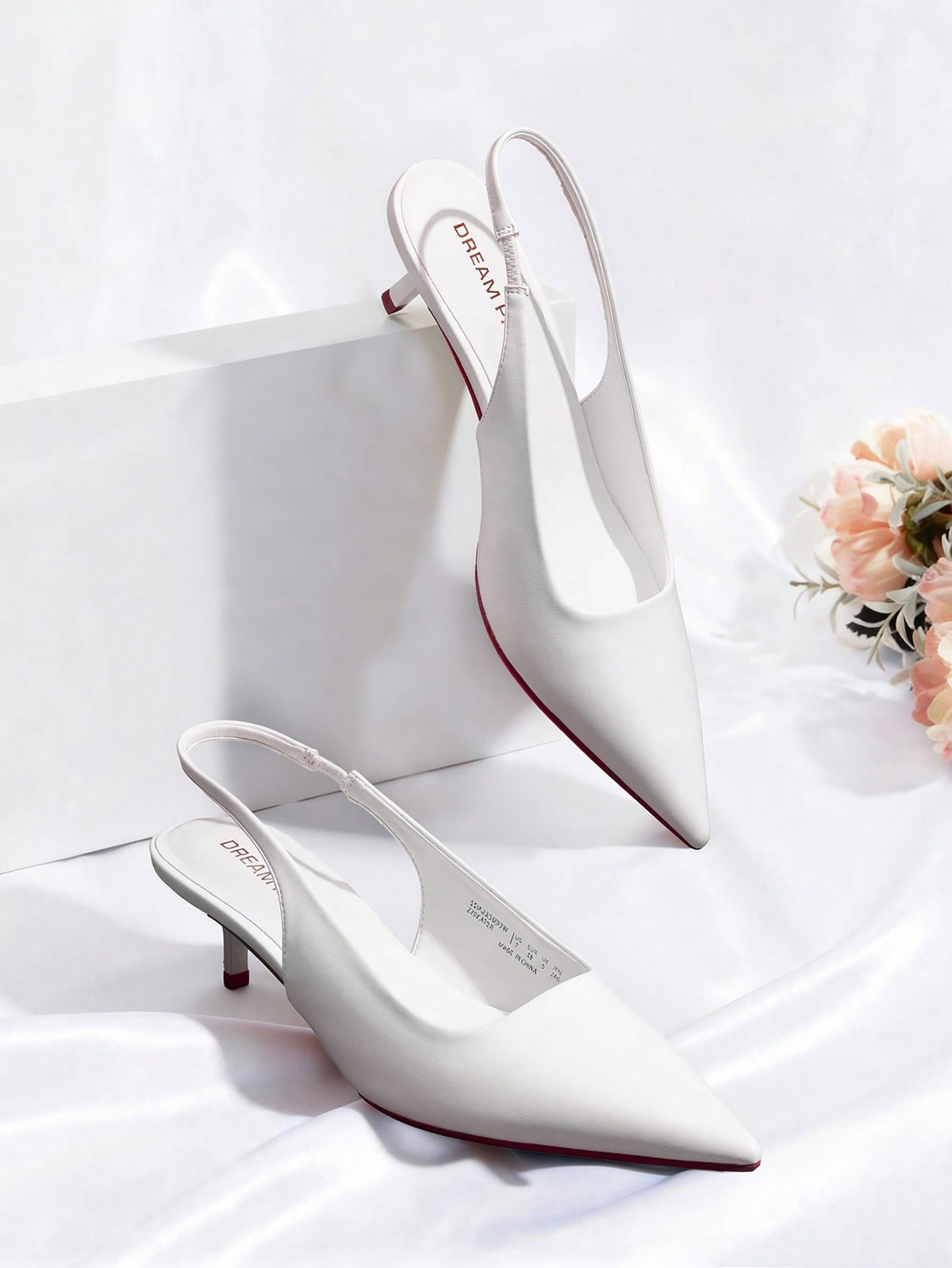 Pointed toe slingback kitten heel pumps in burgundy patent leather with low heel and slip-on strap for women