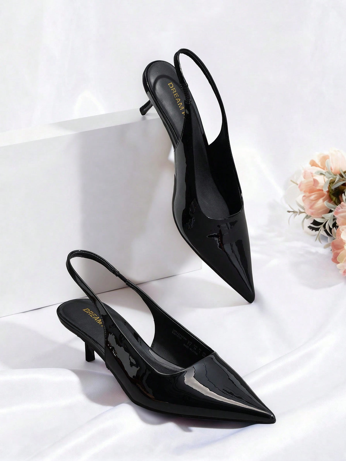 Pointed toe slingback kitten heel pumps in burgundy patent leather with low heel and slip-on strap for women