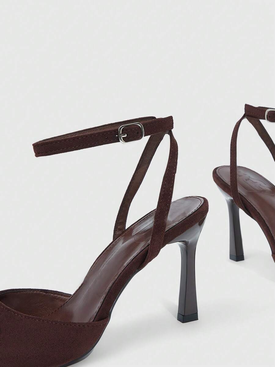 Minimalist women's open toe high heel sandals featuring a slender stiletto heel and adjustable ankle strap buckle closure.