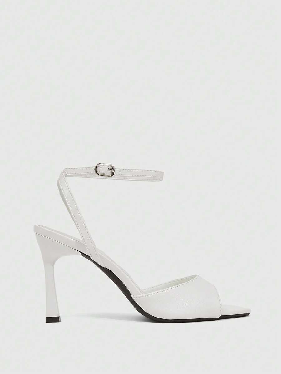 Minimalist women's open toe high heel sandals featuring a slender stiletto heel and adjustable ankle strap buckle closure.