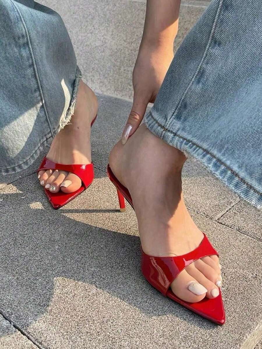 Patent leather open toe slingback slide sandals with stiletto high heels and slip on design.