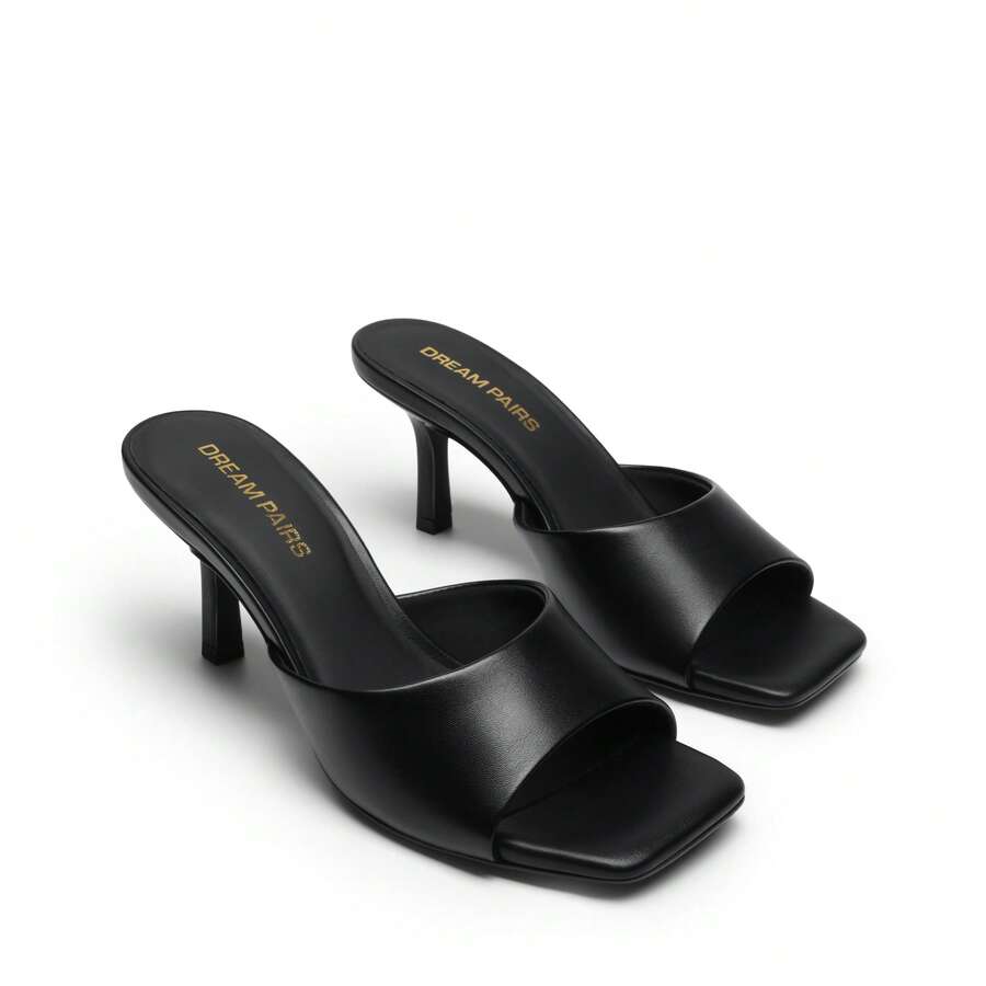 Pair of women's open square toe kitten heel mule sandals in white PU leather with slip-on styling.