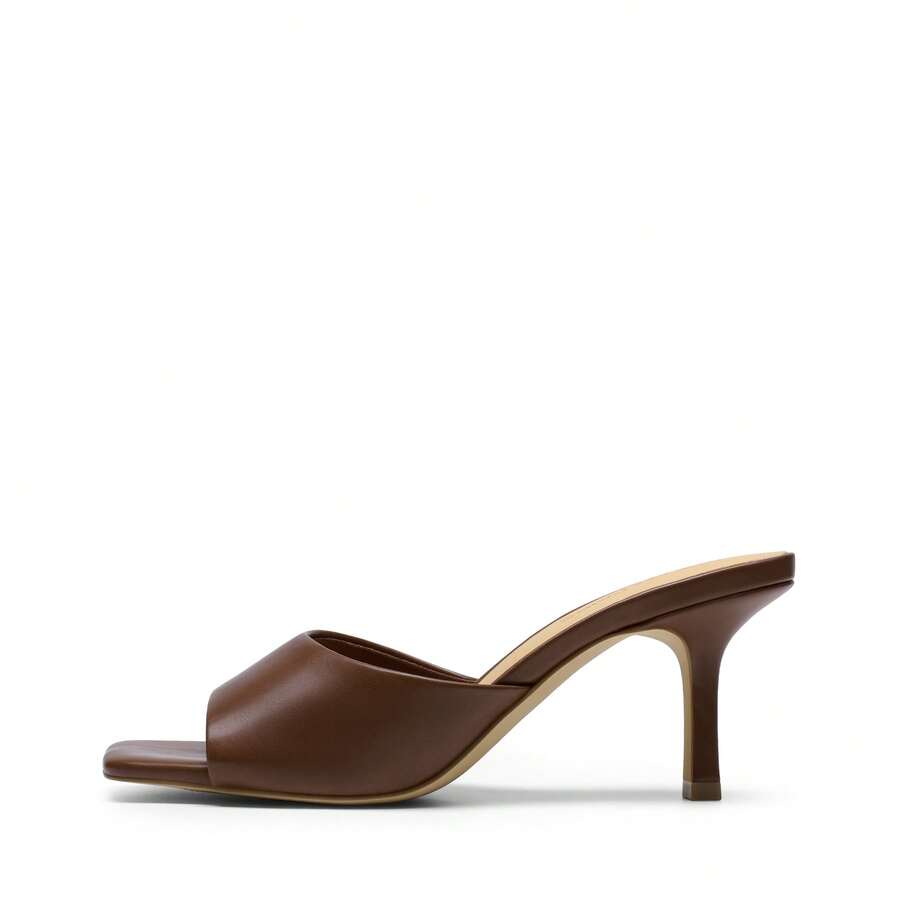 Pair of women's open square toe kitten heel mule sandals in white PU leather with slip-on styling.