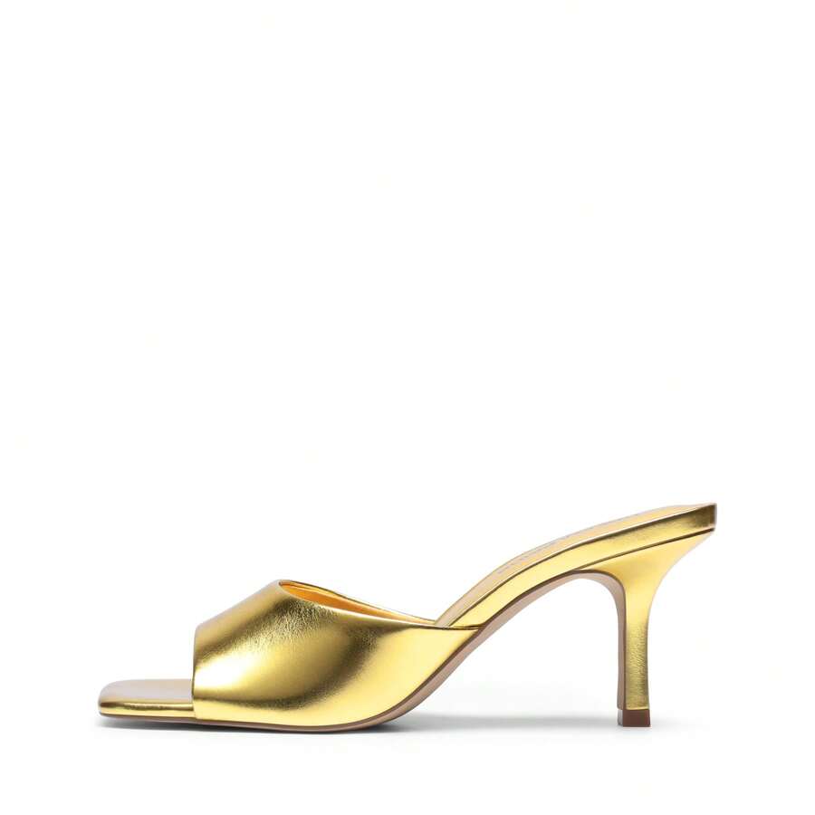 Pair of women's open square toe kitten heel mule sandals in white PU leather with slip-on styling.