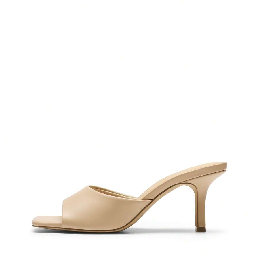 Pair of women's open square toe kitten heel mule sandals in white PU leather with slip-on styling.