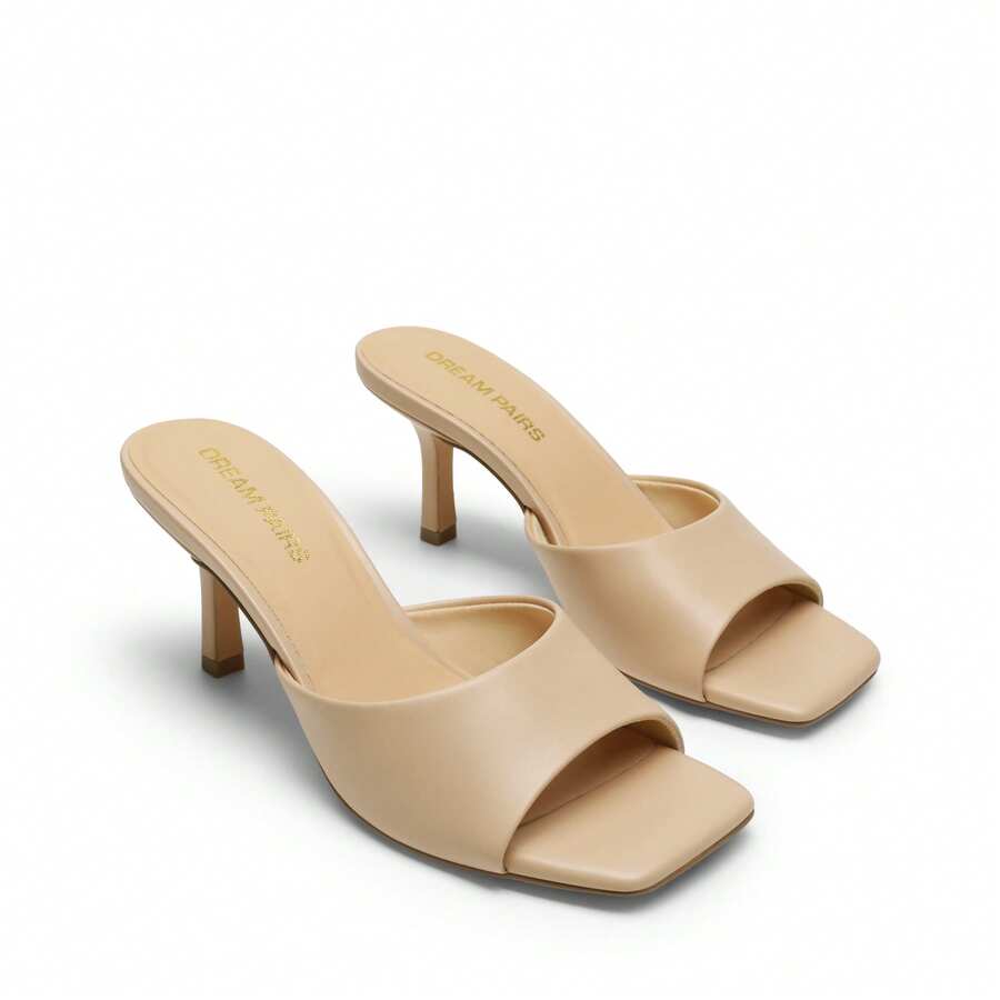 Pair of women's open square toe kitten heel mule sandals in white PU leather with slip-on styling.