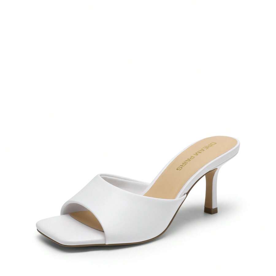 Pair of women's open square toe kitten heel mule sandals in white PU leather with slip-on styling.