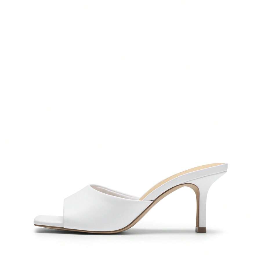 Pair of women's open square toe kitten heel mule sandals in white PU leather with slip-on styling.