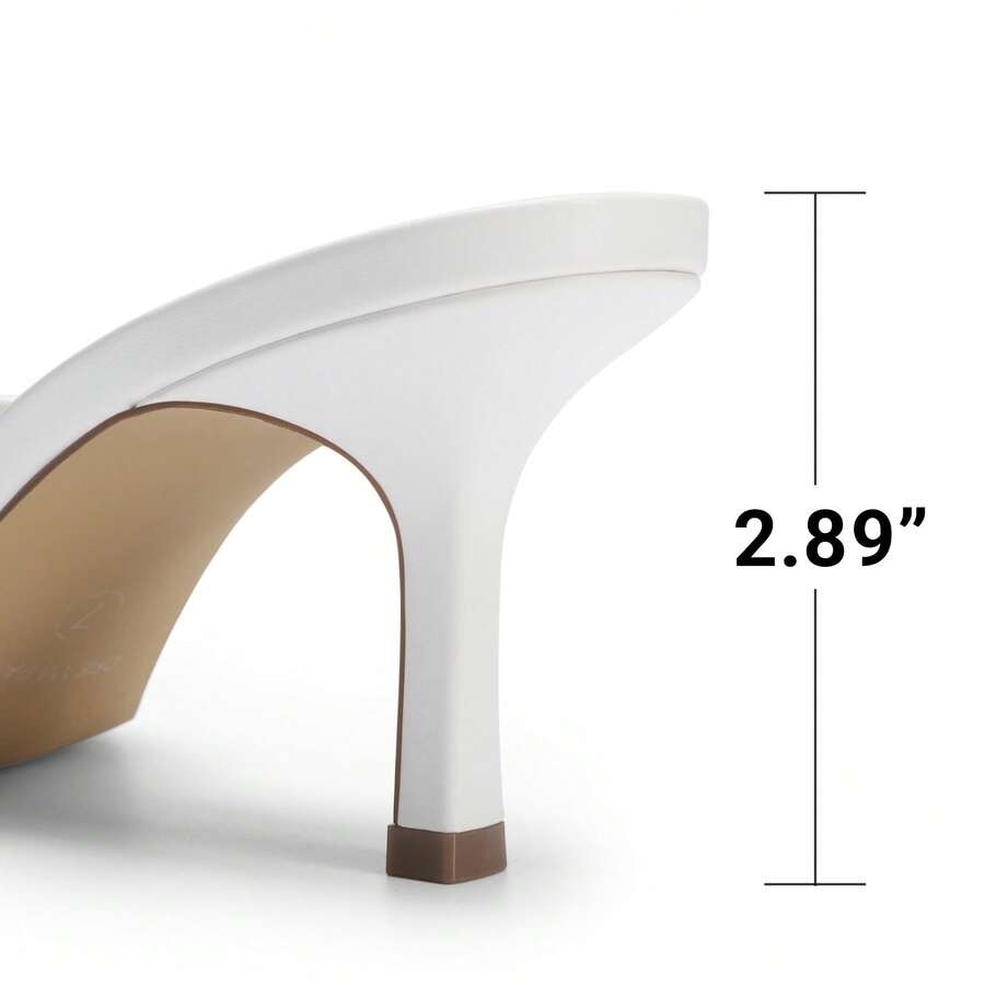 Pair of women's open square toe kitten heel mule sandals in white PU leather with slip-on styling.
