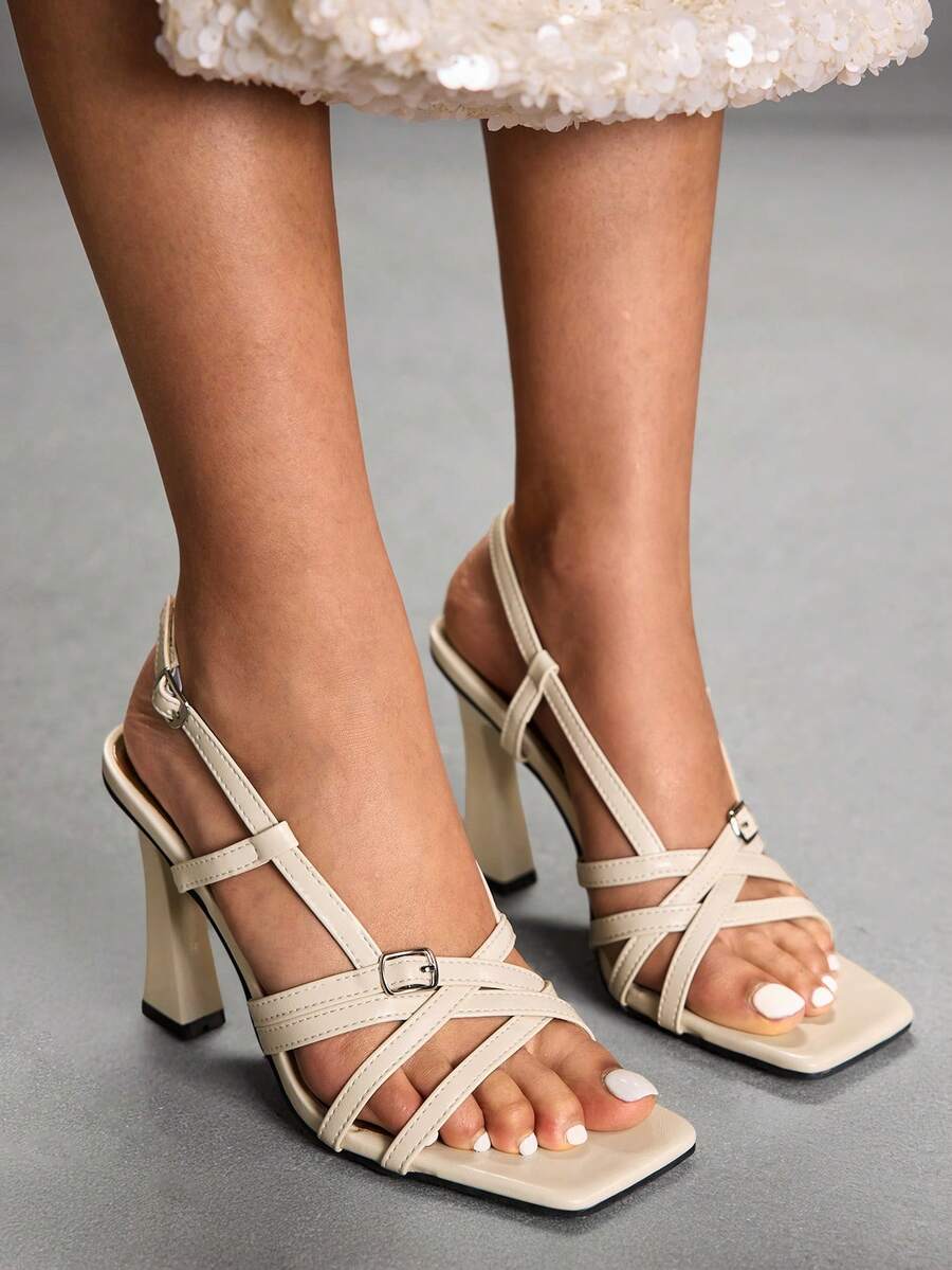 Women's square toe high heel sandals featuring cross straps, slingback heel support, and stiletto heels.