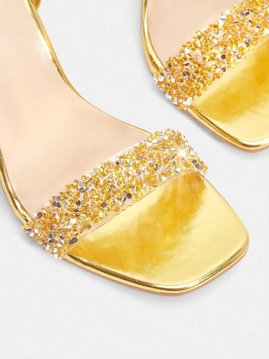 Women's clear jelly tie up high heel sandals featuring sparkling rhinestone embellishments, open toe design, and a chunky mid heel