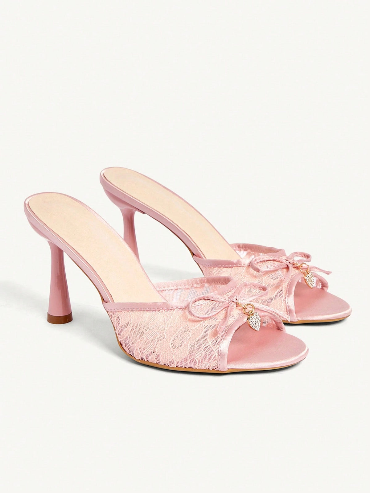 Elegant women's pointed toe high heel mules crafted from smooth PU leather with stiletto heels and delicate bow detail.