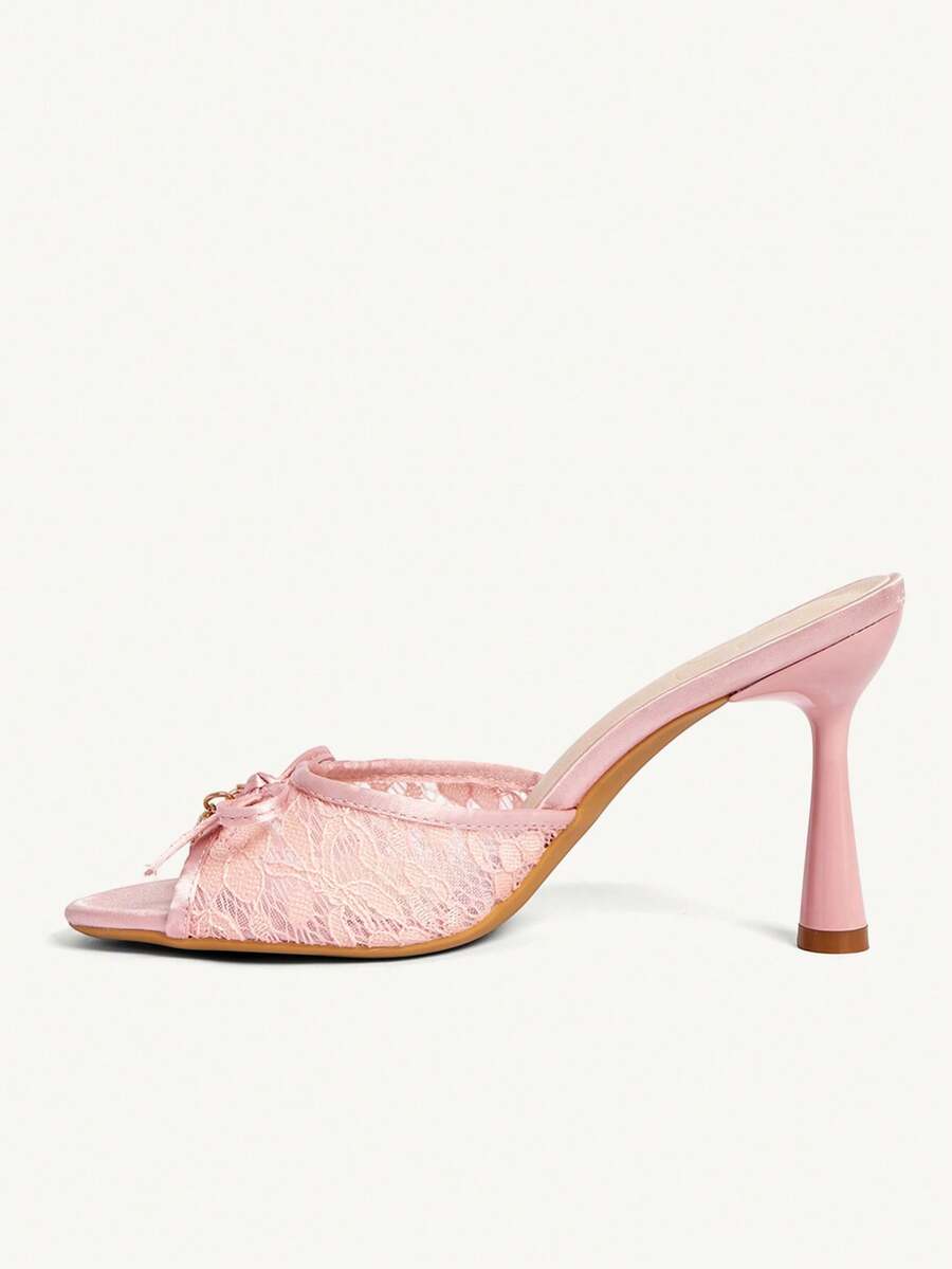 Elegant women's pointed toe high heel mules crafted from smooth PU leather with stiletto heels and delicate bow detail.
