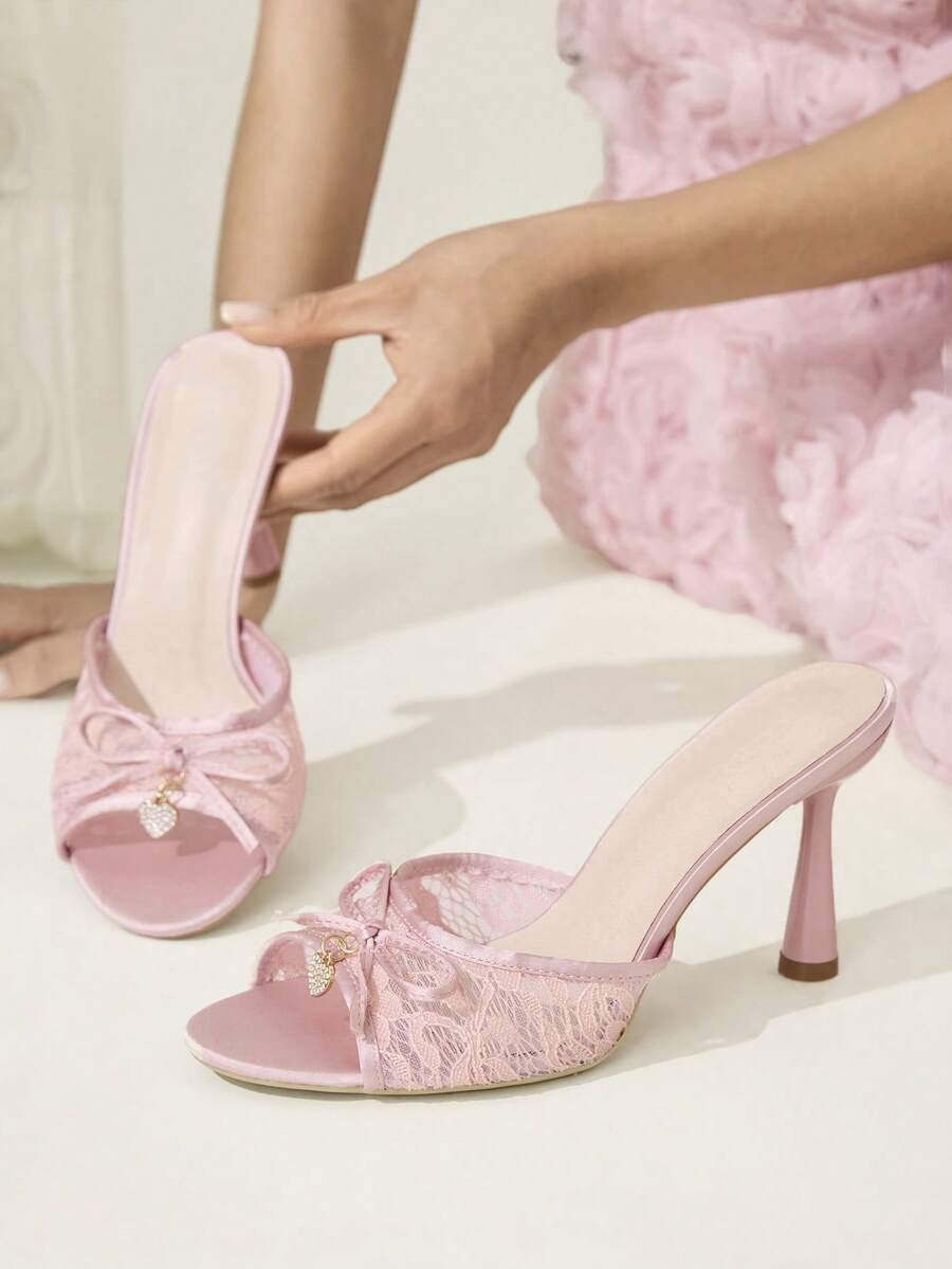Elegant women's pointed toe high heel mules crafted from smooth PU leather with stiletto heels and delicate bow detail.