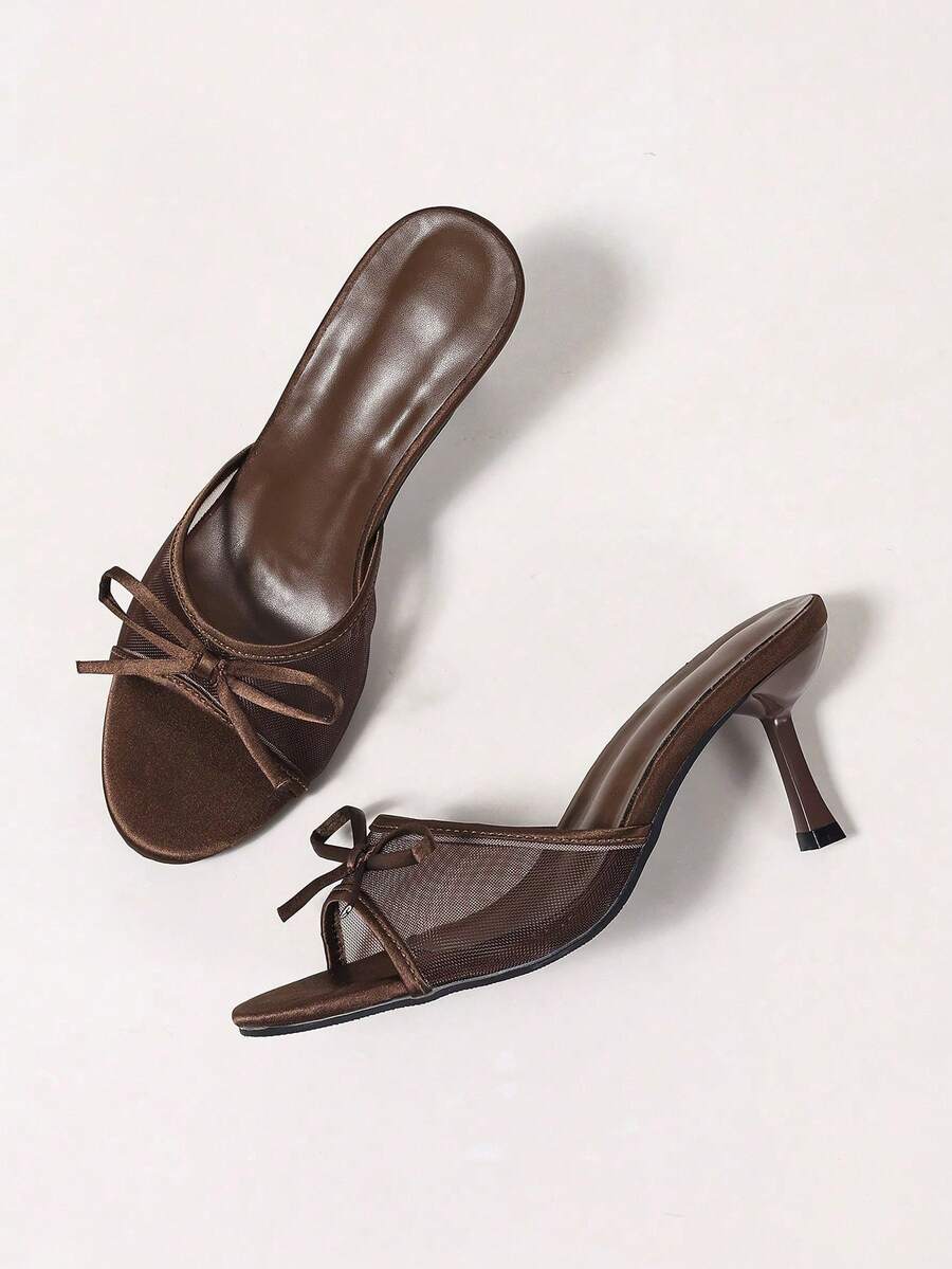 Women's black open toe mesh slide sandals with bowknot detail and stiletto heels