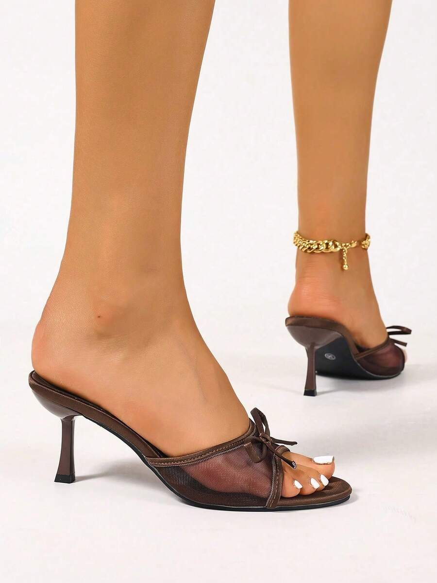 Women's black open toe mesh slide sandals with bowknot detail and stiletto heels
