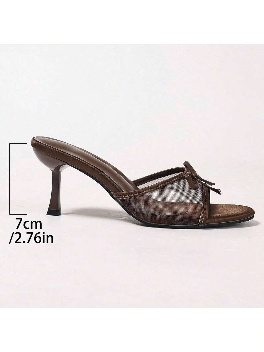 Women's black open toe mesh slide sandals with bowknot detail and stiletto heels