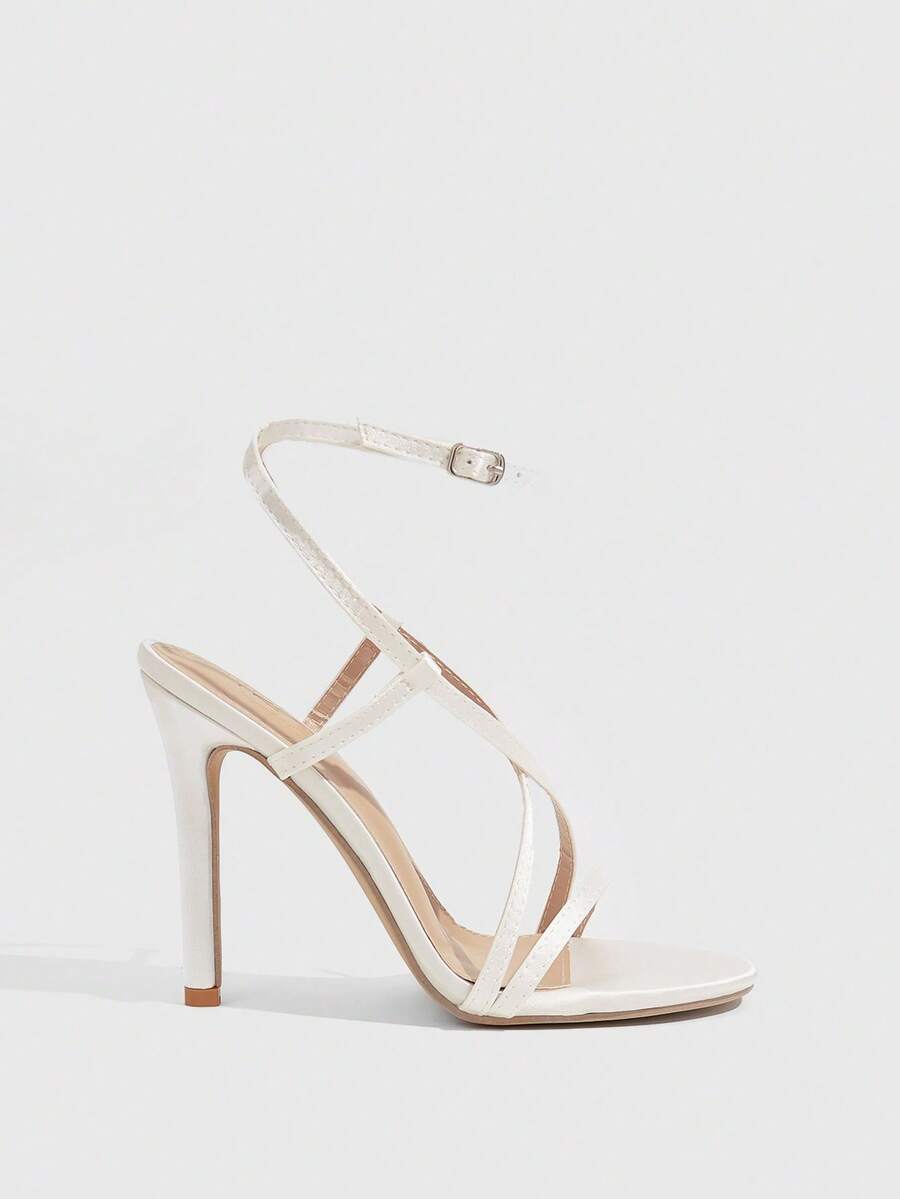 Women's square toe high heel sandals featuring crystal embellishments and crossover ankle straps with buckle closure