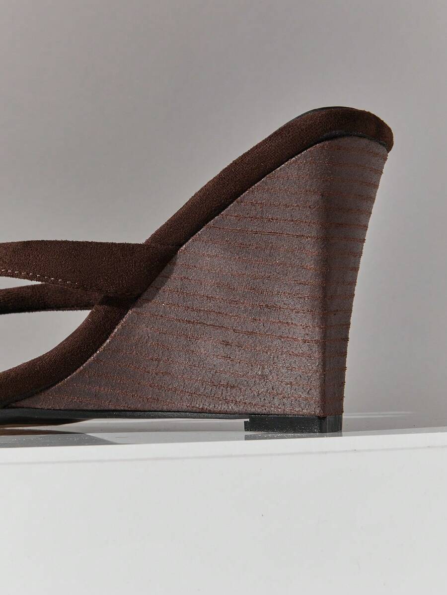 Women's faux suede thong wedge sandals featuring rope detail and high platform wedge sole