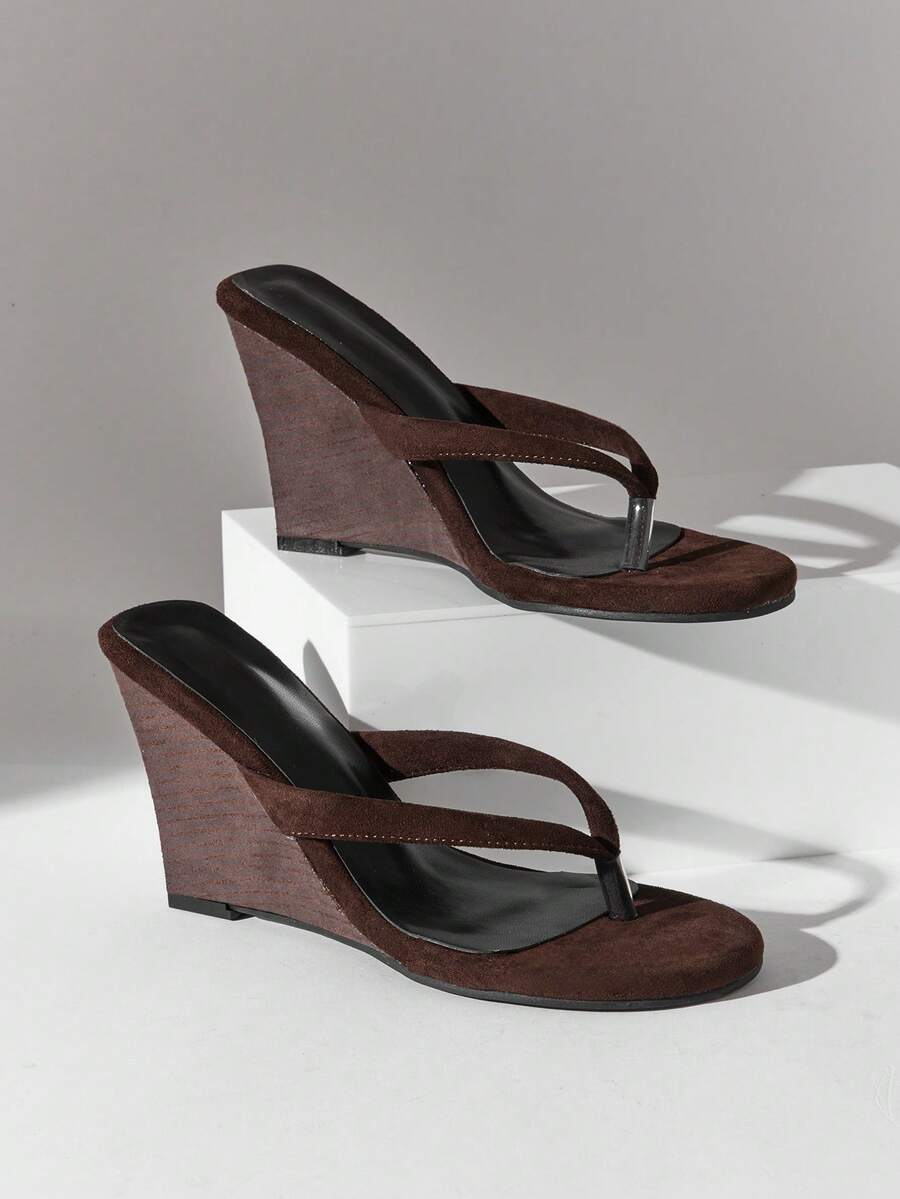 Women's faux suede thong wedge sandals featuring rope detail and high platform wedge sole