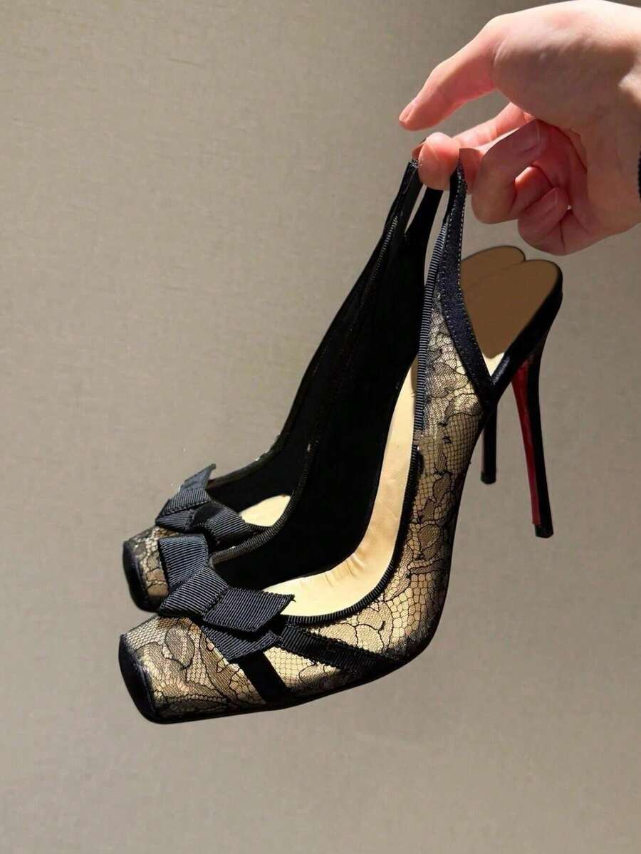 Black lace high heel sandals for women with a big bowknot, closed square toe, and stiletto heel.
