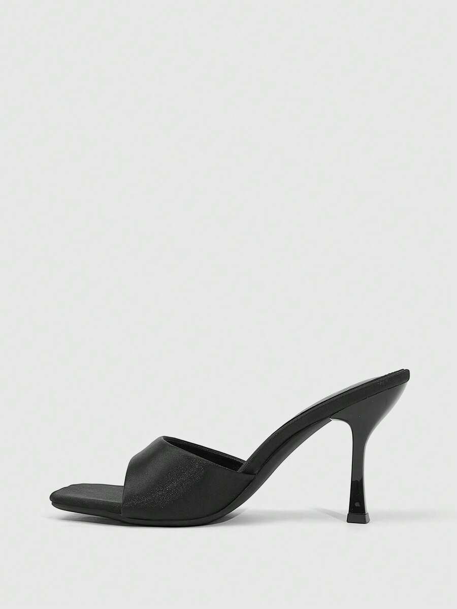 Women's open square toe slender high heel sandals with slingback strap and metal buckle detailing.