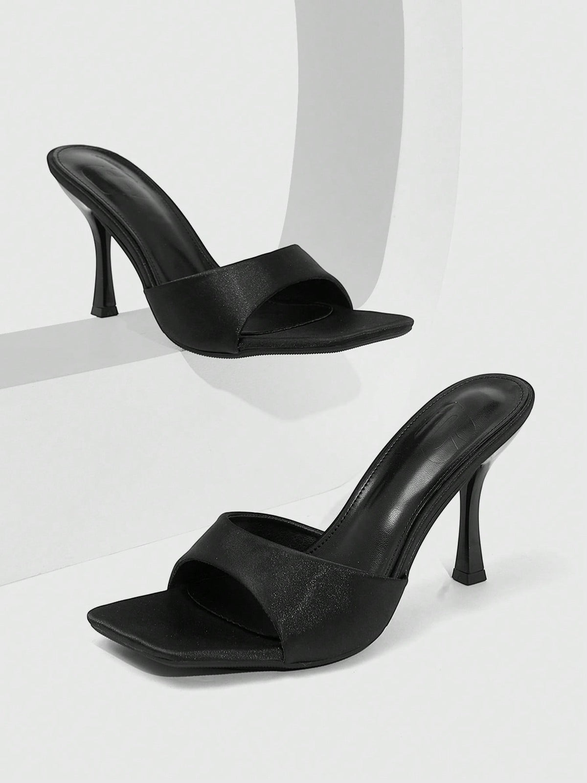 Women's open square toe slender high heel sandals with slingback strap and metal buckle detailing.
