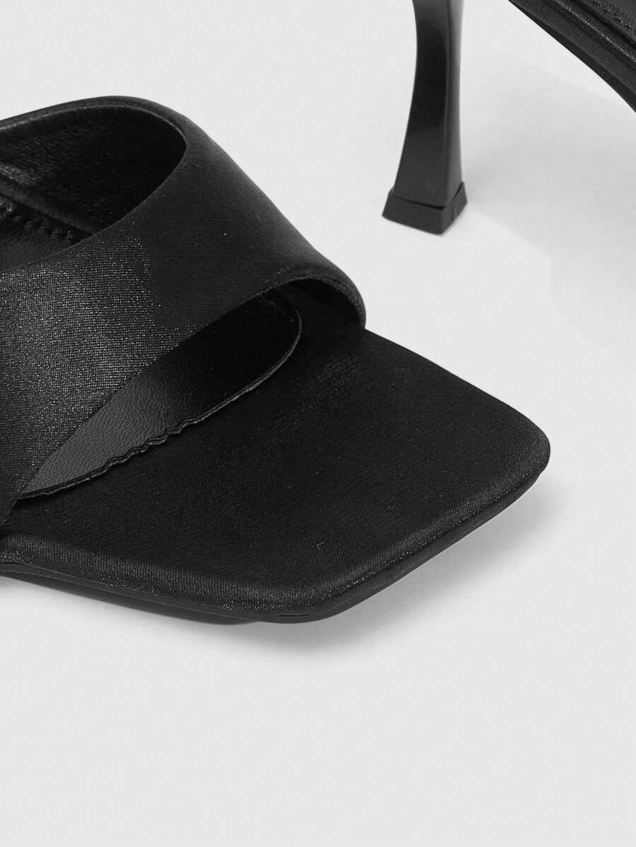 Women's open square toe slender high heel sandals with slingback strap and metal buckle detailing.