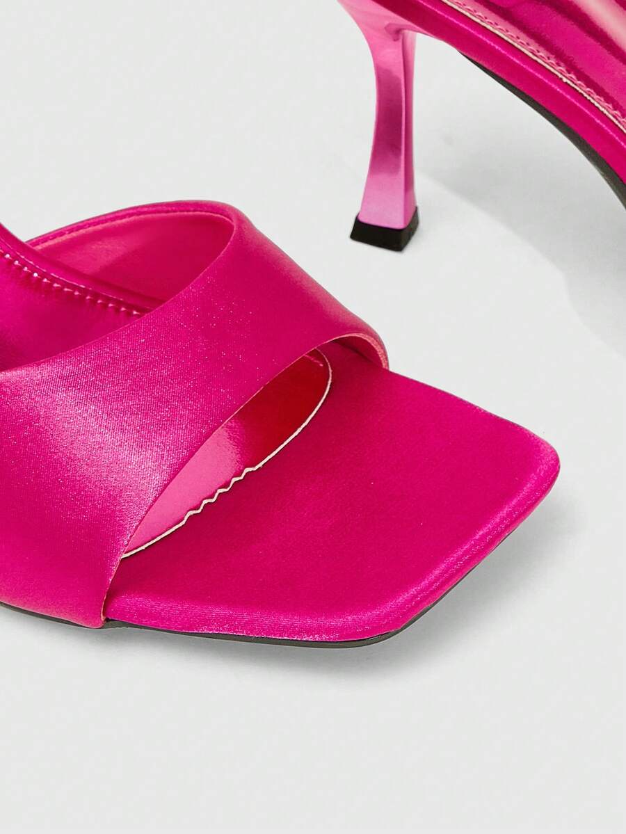 Women's open square toe slender high heel sandals with slingback strap and metal buckle detailing.