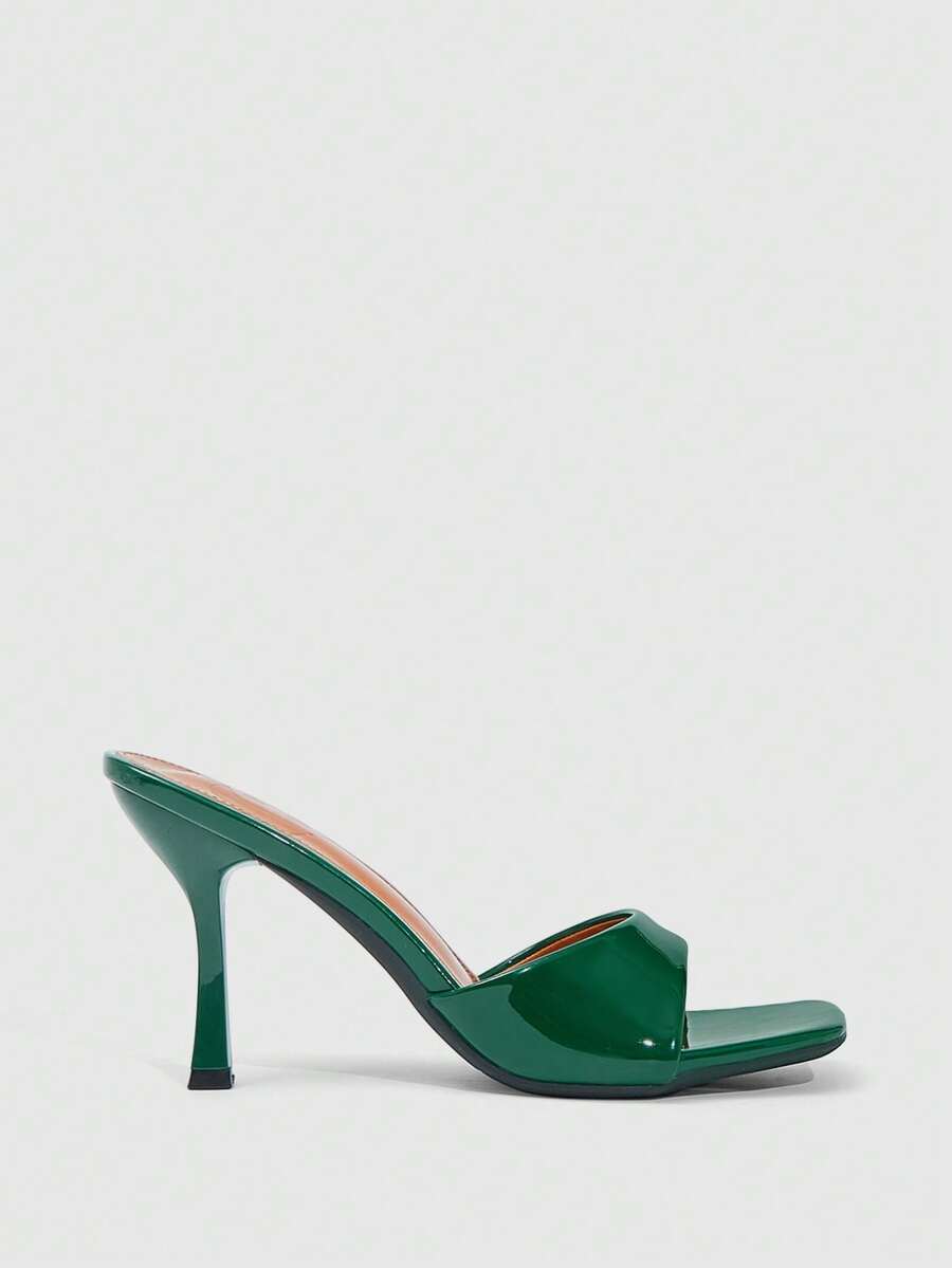 Women's open square toe slender high heel sandals with slingback strap and metal buckle detailing.