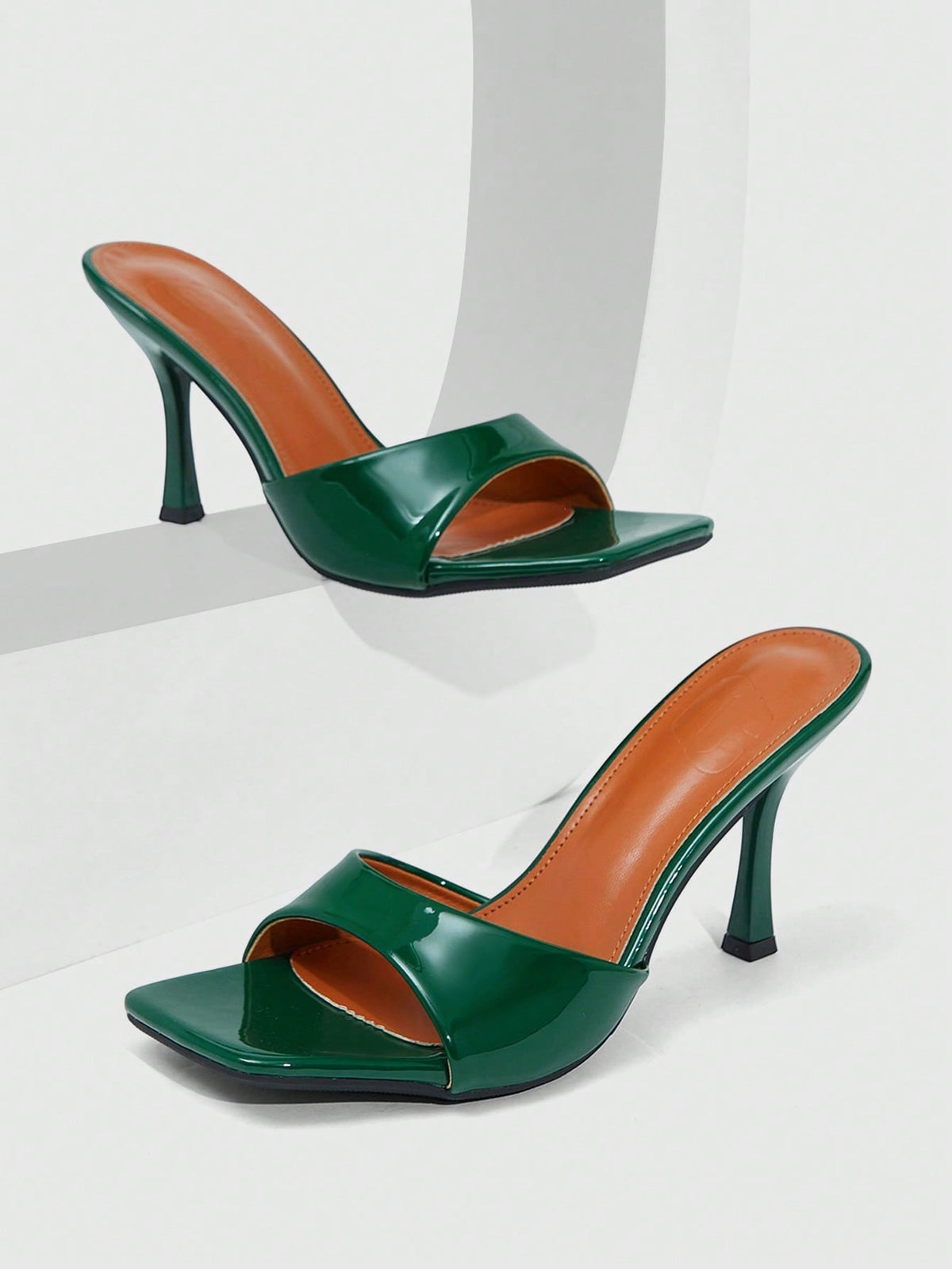 Women's open square toe slender high heel sandals with slingback strap and metal buckle detailing.