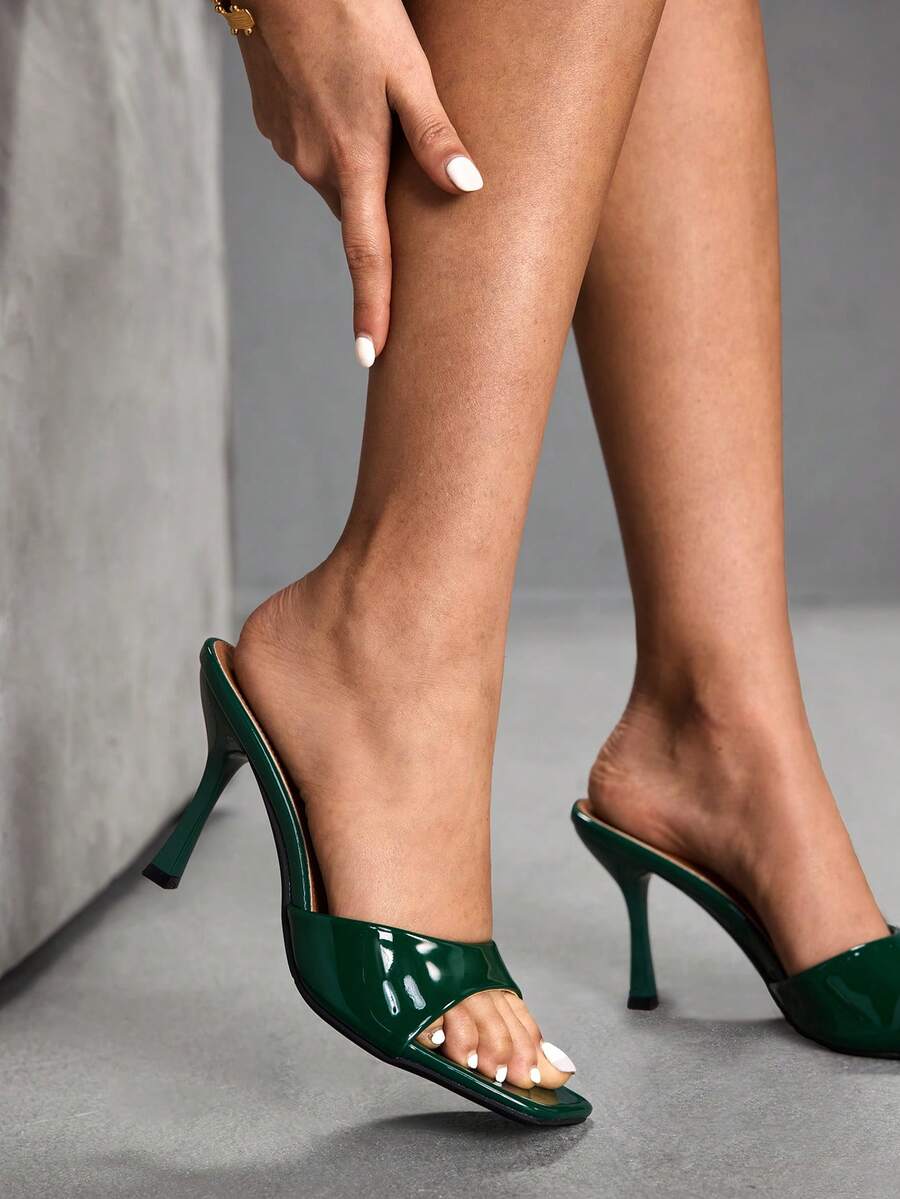 Women's open square toe slender high heel sandals with slingback strap and metal buckle detailing.