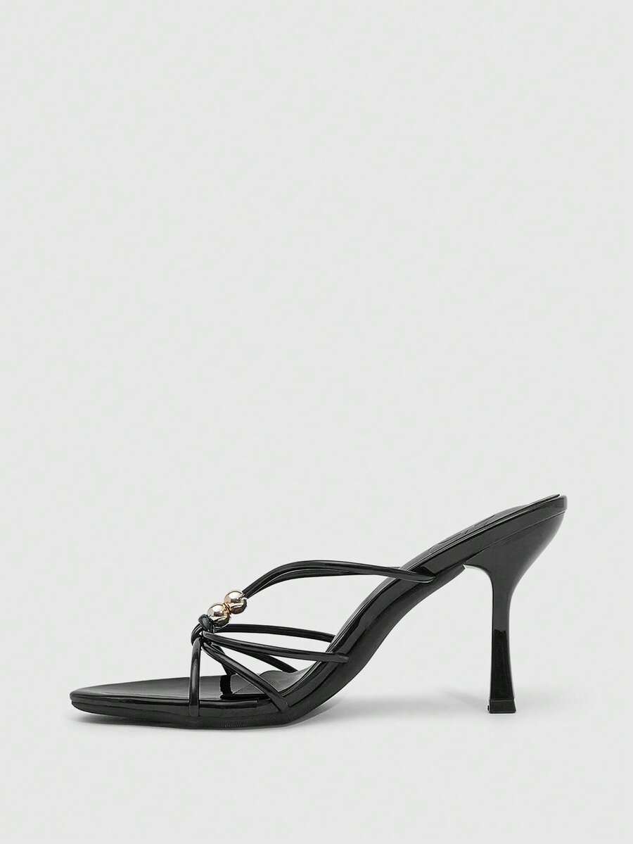Burgundy stiletto high heel sandals featuring open toe thin straps and knot details