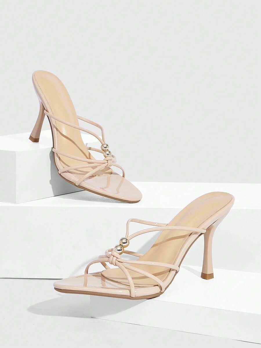 Burgundy stiletto high heel sandals featuring open toe thin straps and knot details