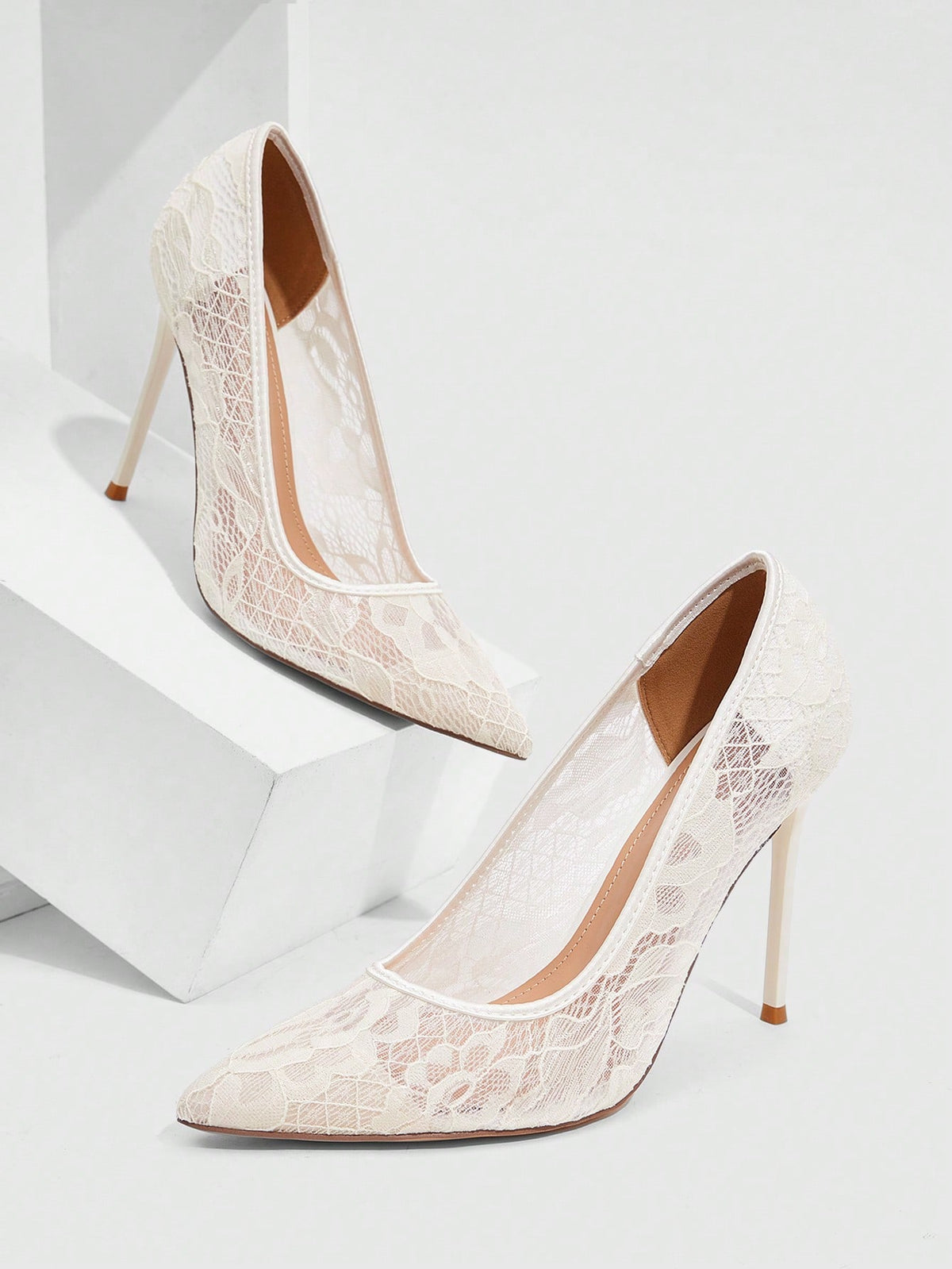 Women's pointed clear lace heels with contrast mesh, floral embroidery, and stiletto high heel with buckle strap.