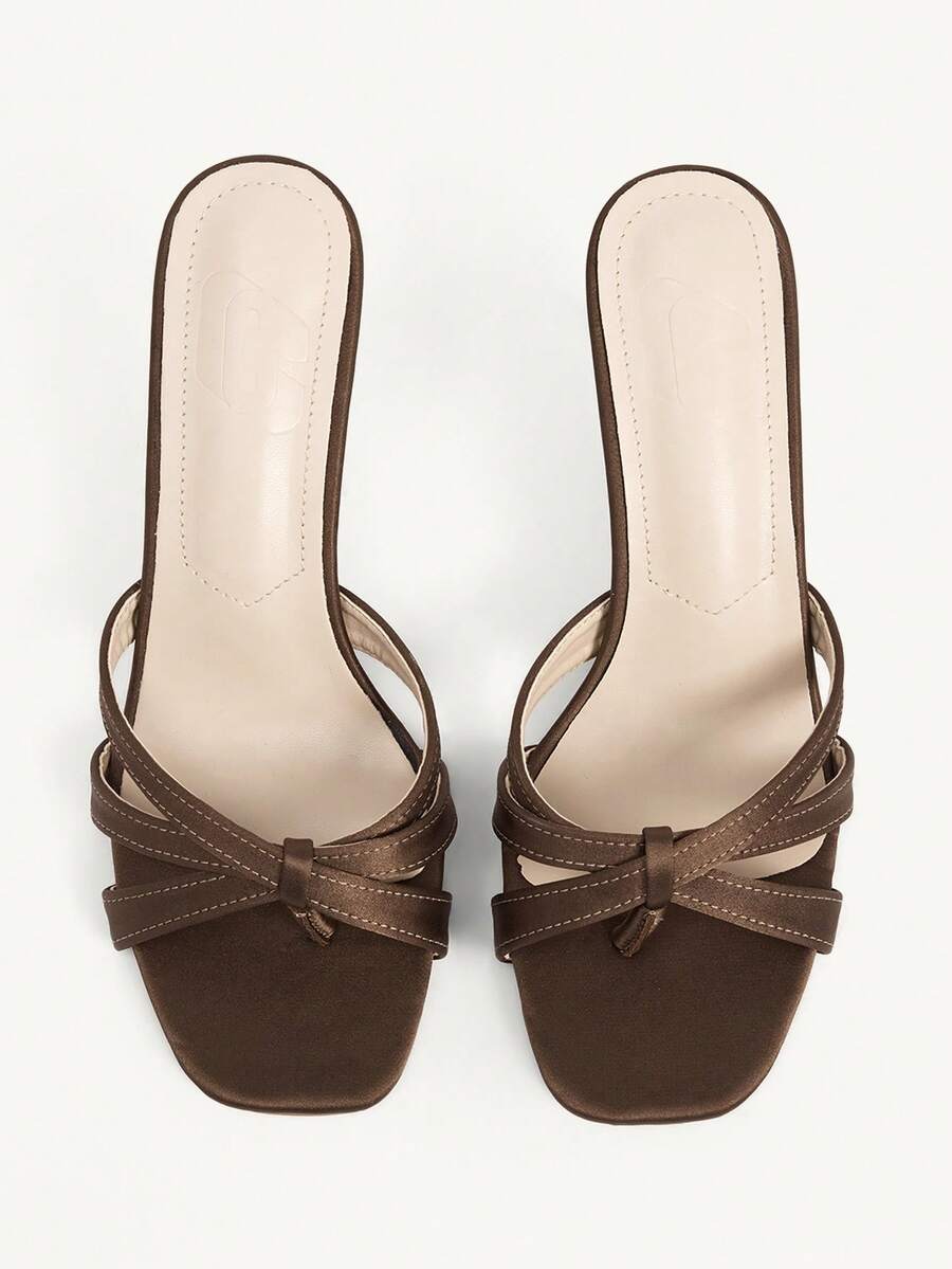 Square toe gold metallic heel sandals for women featuring open toe, crossover slingback strap, and stiletto mid heel for weddings and parties.