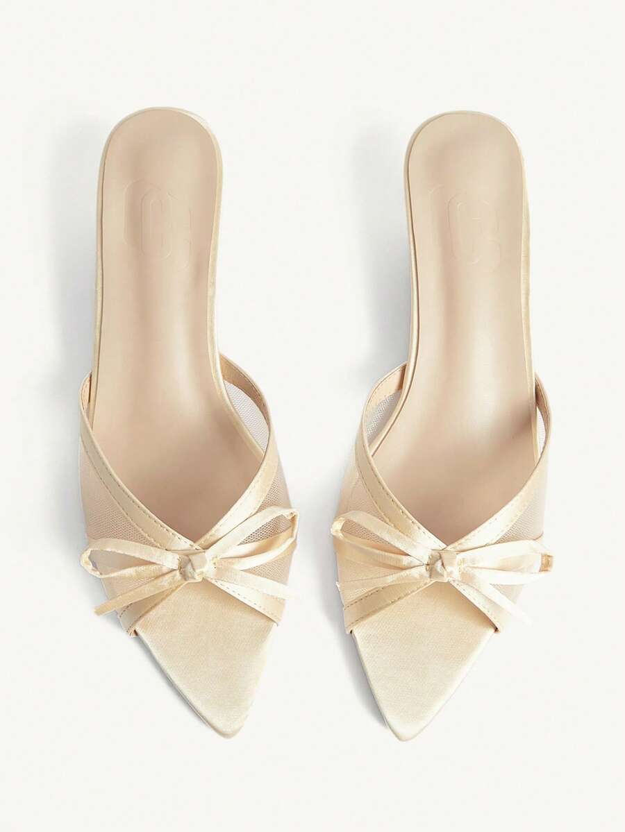 Pointed toe high-heeled slippers in PU leather with decorative buckle detail and low kitten heels for women.