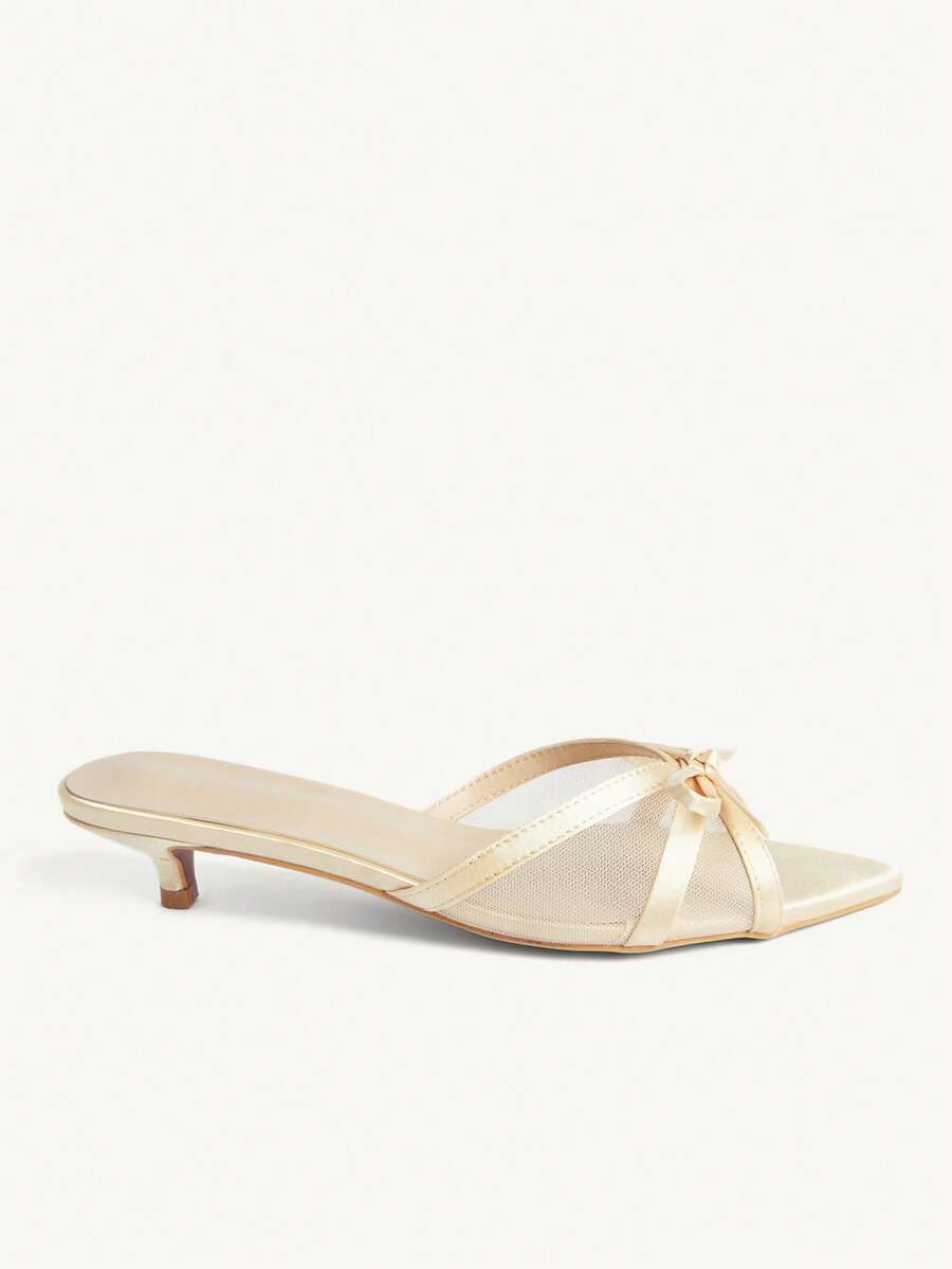 Pointed toe high-heeled slippers in PU leather with decorative buckle detail and low kitten heels for women.