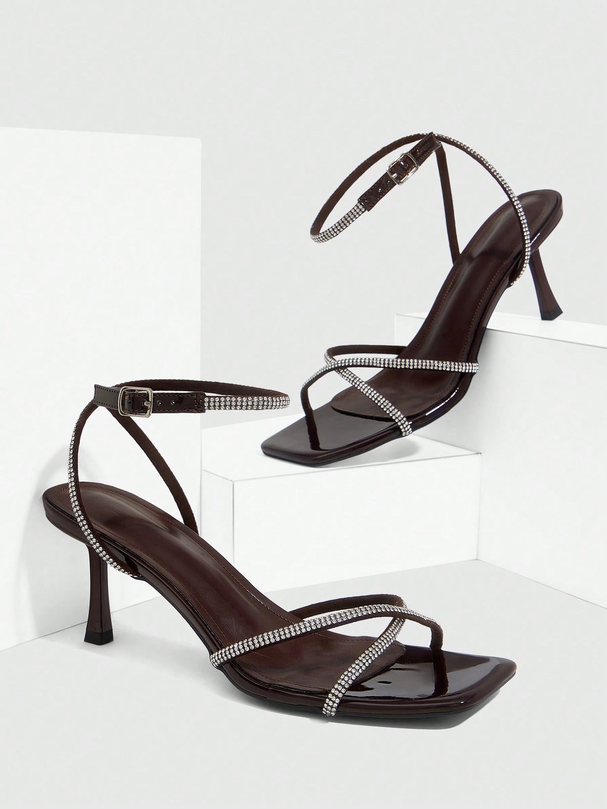 Women's open toe stiletto heel sandals featuring square toe design, criss-cross rhinestone slim straps, and secure ankle strap.