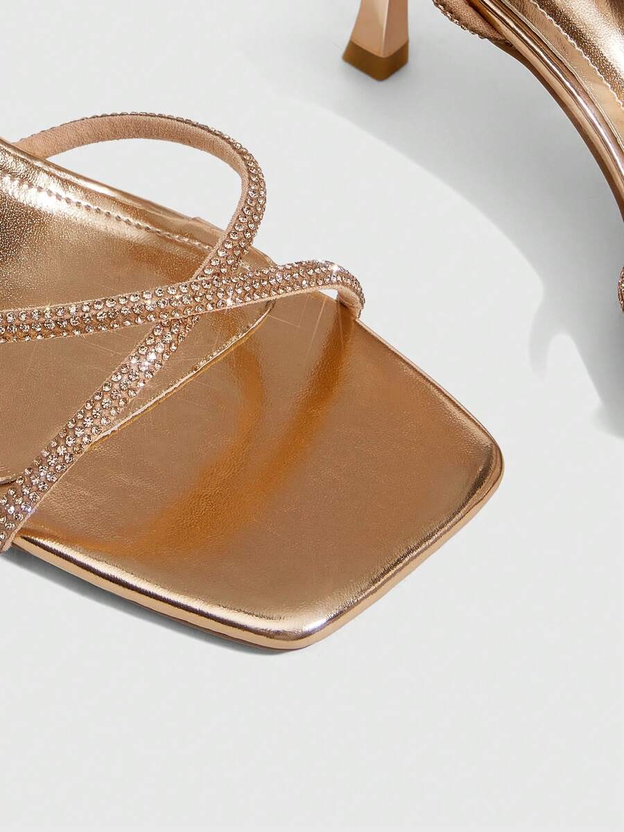 Women's open toe stiletto heel sandals featuring square toe design, criss-cross rhinestone slim straps, and secure ankle strap.