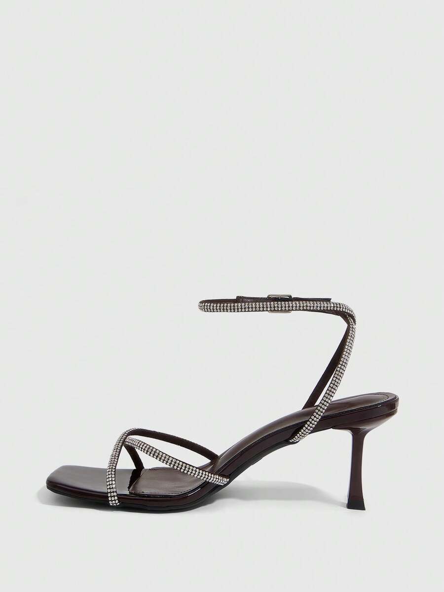 Women's open toe stiletto heel sandals featuring square toe design, criss-cross rhinestone slim straps, and secure ankle strap.