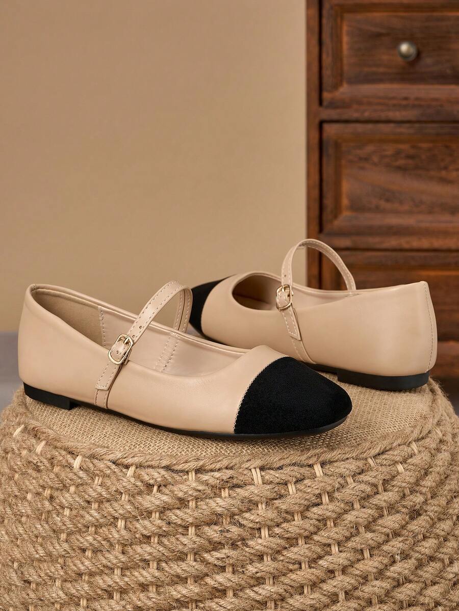 Pair of women's square toe slip-on flat shoes featuring a delicate bow detail and low vamp design.